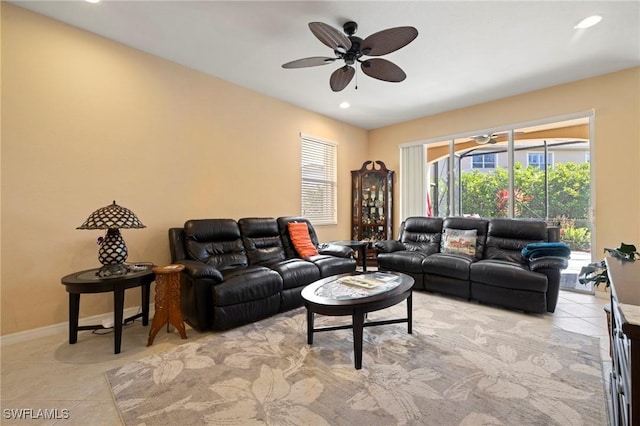 living room featuring recessed lighting, baseboards, ceiling fan, and light tile patterned flooring