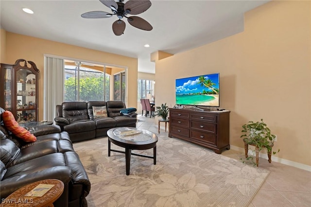 living room featuring light tile patterned flooring, recessed lighting, baseboards, and a ceiling fan