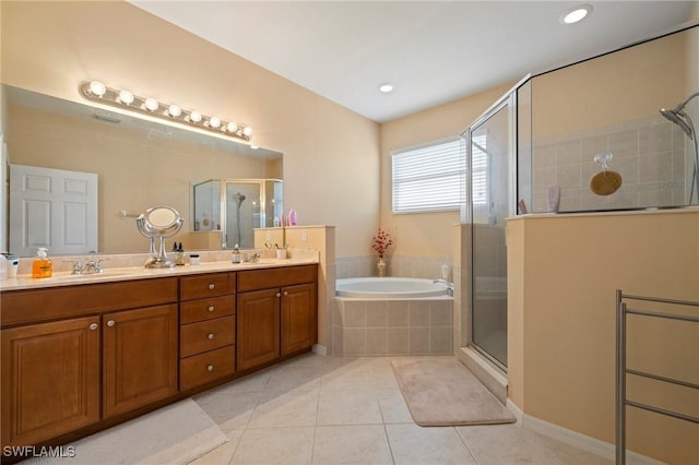 full bathroom featuring tile patterned flooring, a shower stall, a bath, and double vanity