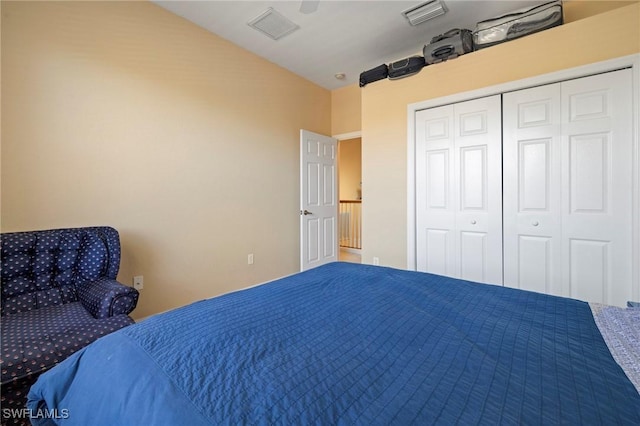 bedroom featuring a closet, visible vents, and a ceiling fan