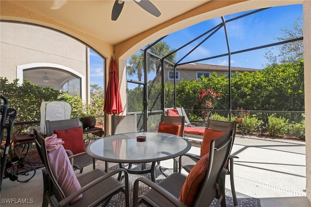 sunroom with a ceiling fan