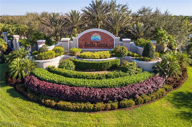 community / neighborhood sign with a lawn