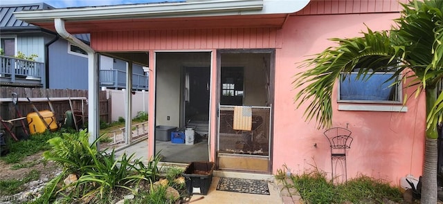 property entrance featuring fence