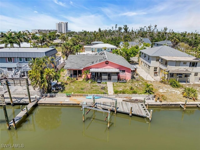 view of dock featuring a residential view and a water view