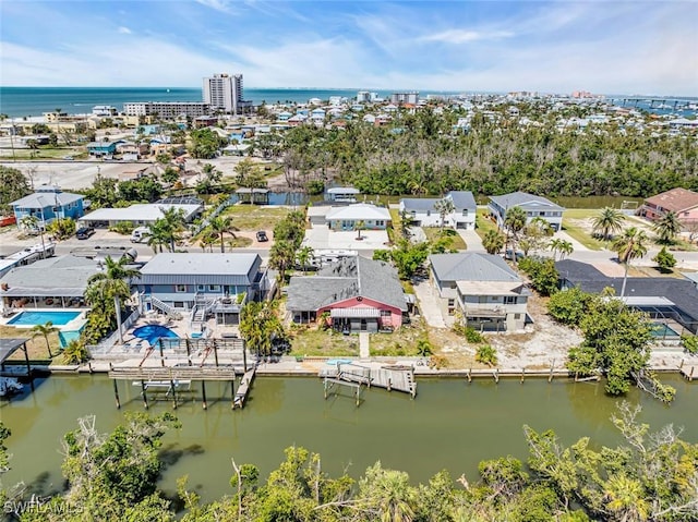 bird's eye view featuring a residential view and a water view