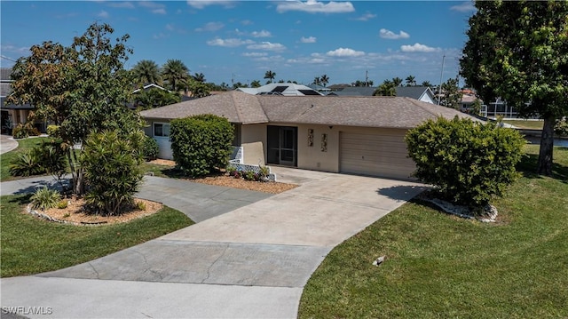 ranch-style house featuring an attached garage, a shingled roof, stucco siding, a front lawn, and concrete driveway