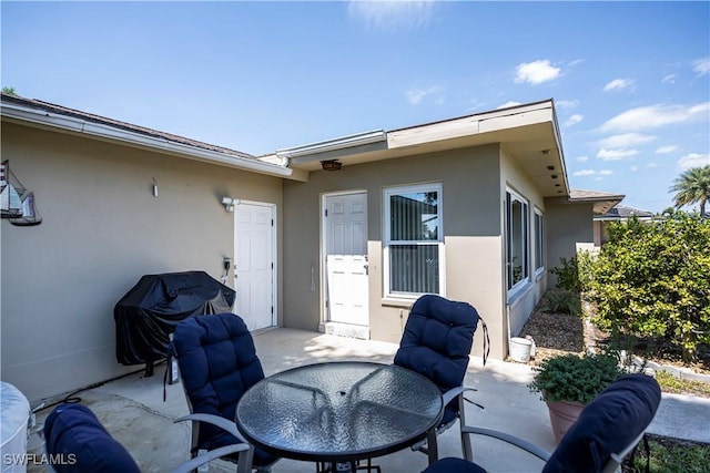 view of patio featuring outdoor dining area and grilling area