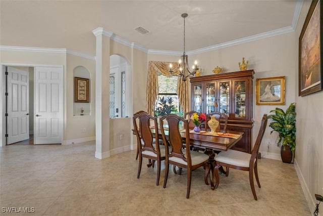 dining area with visible vents, ornamental molding, arched walkways, baseboards, and a chandelier