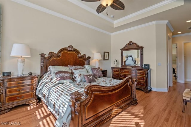 bedroom featuring crown molding, baseboards, light wood finished floors, and ceiling fan