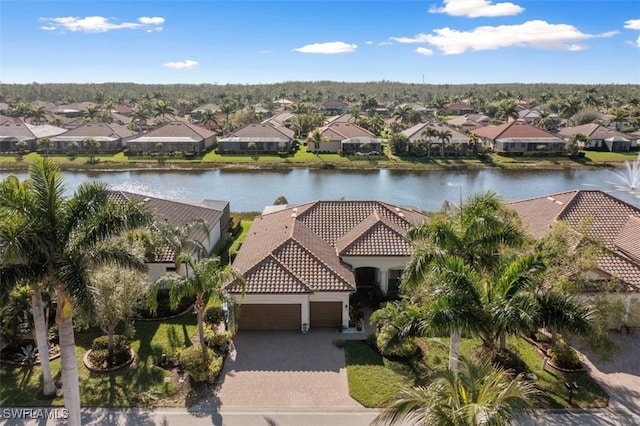 aerial view featuring a residential view and a water view