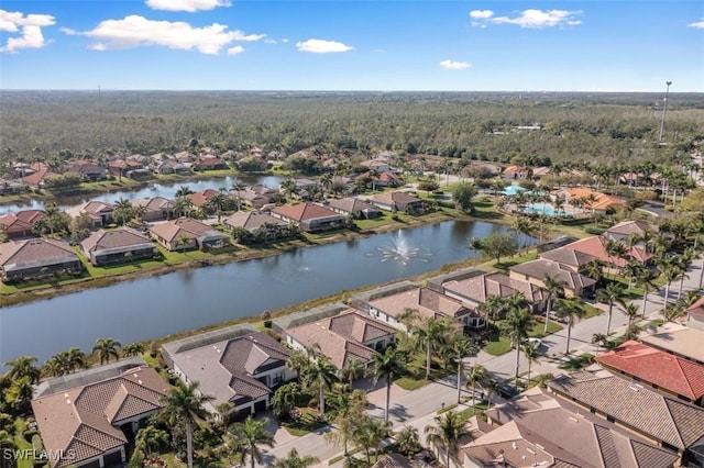 bird's eye view featuring a residential view and a water view