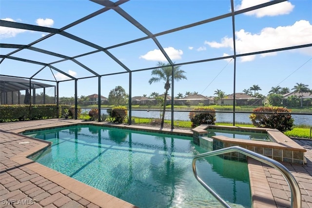 view of pool with glass enclosure, a pool with connected hot tub, and a patio area