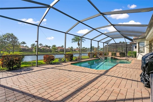 view of pool with glass enclosure, a patio area, a water view, and a pool with connected hot tub