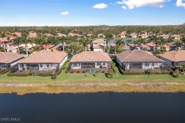 birds eye view of property featuring a residential view and a water view