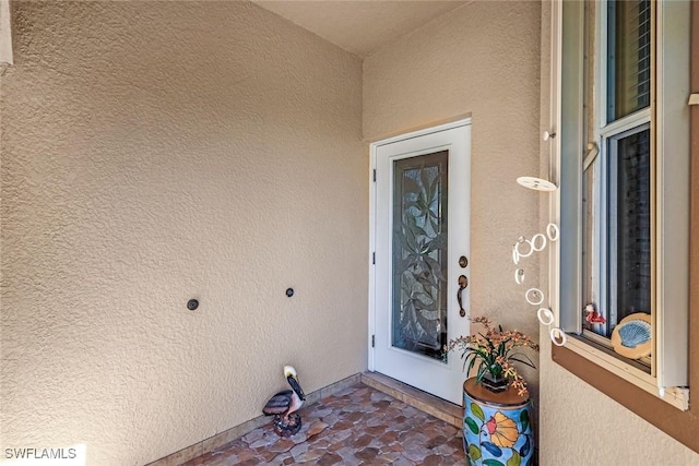 8339 Langshire Way, Fort Myers, FL 33912 - property entrance featuring stucco siding