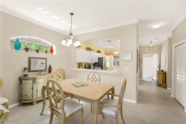8339 Langshire Way, Fort Myers, FL 33912 - dining space featuring baseboards, light tile patterned flooring, a chandelier, and crown molding