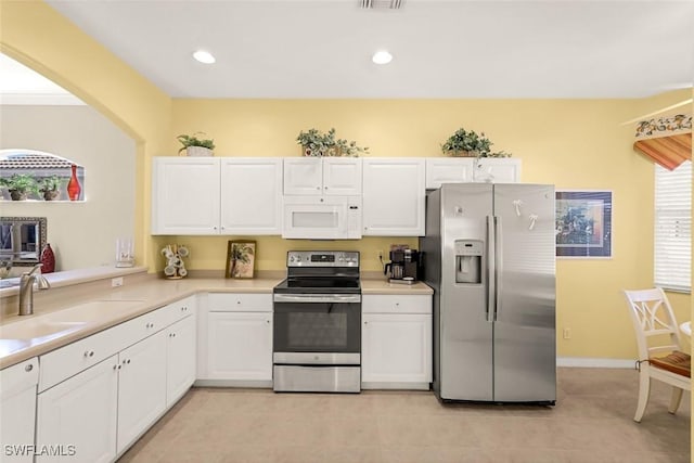 8339 Langshire Way, Fort Myers, FL 33912 - kitchen with light countertops, appliances with stainless steel finishes, white cabinetry, and a sink