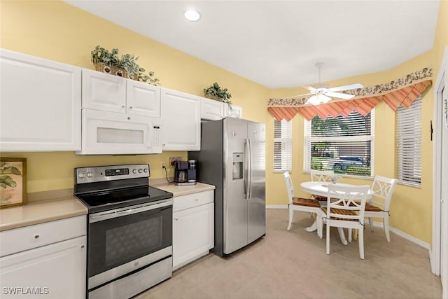 8339 Langshire Way, Fort Myers, FL 33912 - kitchen with light countertops, white cabinetry, appliances with stainless steel finishes, and a ceiling fan