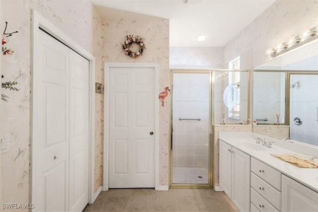 8339 Langshire Way, Fort Myers, FL 33912 - bathroom with wallpapered walls, vanity, a closet, and tile patterned floors