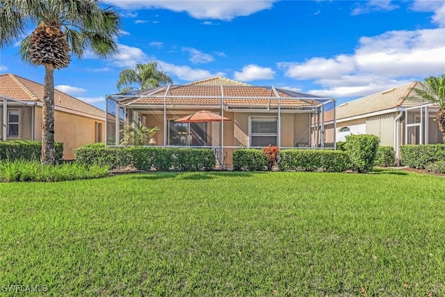 8339 Langshire Way, Fort Myers, FL 33912 - back of house with stucco siding, a tile roof, a lanai, and a yard