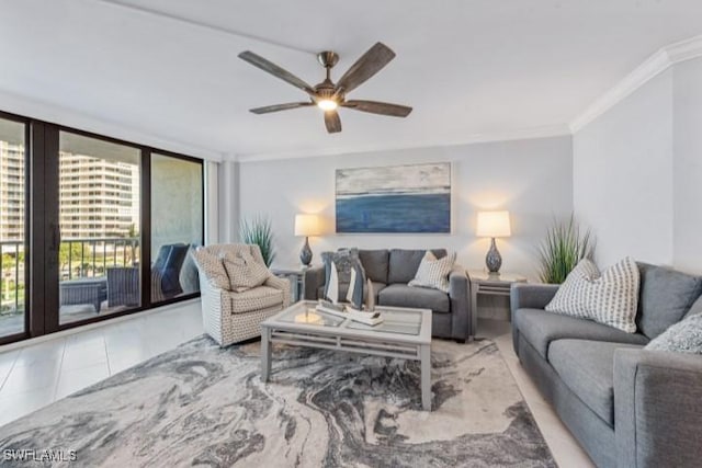 tiled living area with ceiling fan, floor to ceiling windows, and ornamental molding