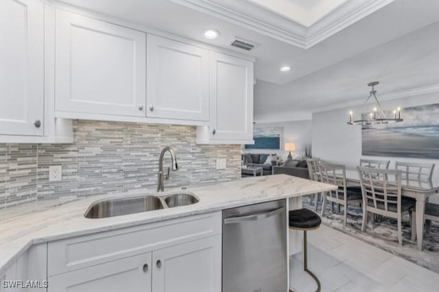 kitchen with a sink, stainless steel dishwasher, white cabinets, and crown molding