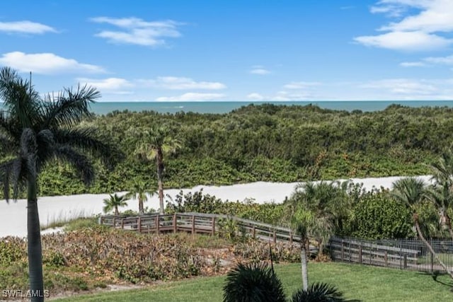 surrounding community featuring fence and a water view