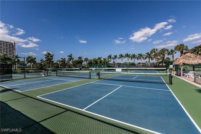 view of sport court featuring fence