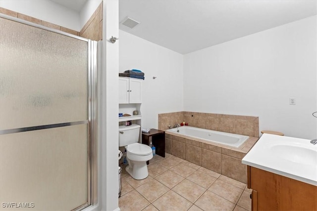 bathroom with tile patterned floors, visible vents, a stall shower, and a garden tub