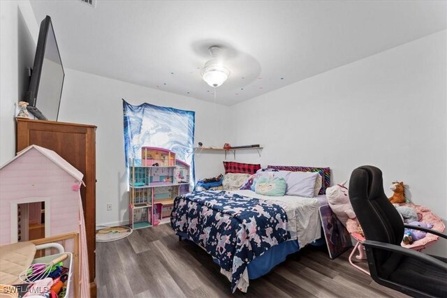 bedroom featuring wood finished floors