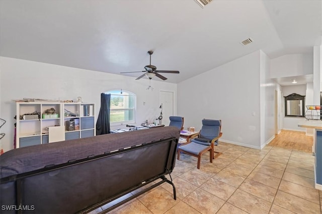 bedroom with visible vents, ceiling fan, baseboards, vaulted ceiling, and light tile patterned floors