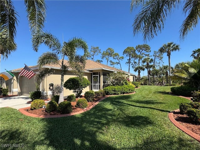 view of property exterior with a yard, driveway, an attached garage, and stucco siding