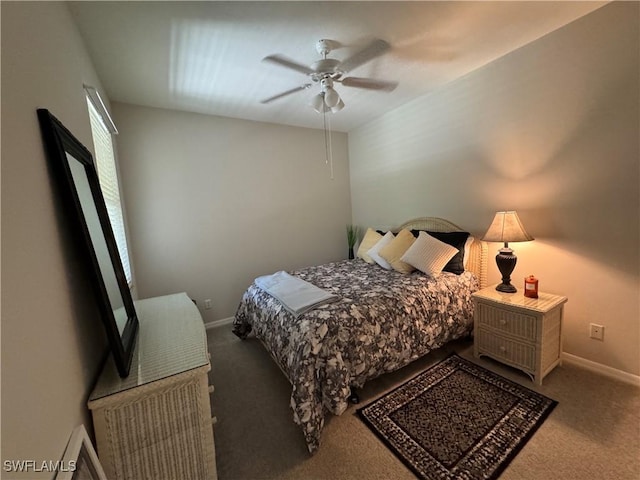 carpeted bedroom featuring a ceiling fan and baseboards