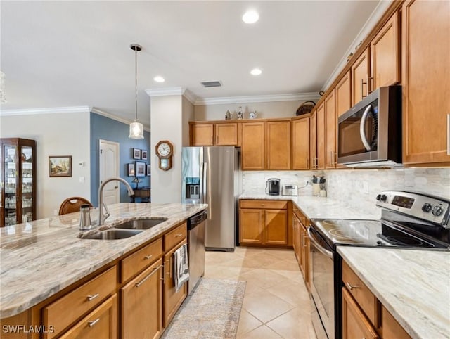 13117 Cardeto Ct, Estero, FL 33928 - kitchen with light stone countertops, visible vents, a sink, appliances with stainless steel finishes, and brown cabinets