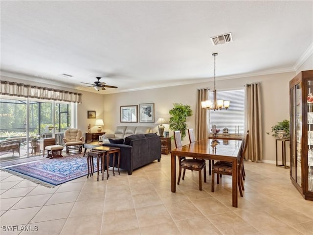 13117 Cardeto Ct, Estero, FL 33928 - dining room featuring visible vents, ceiling fan with notable chandelier, light tile patterned flooring, crown molding, and baseboards