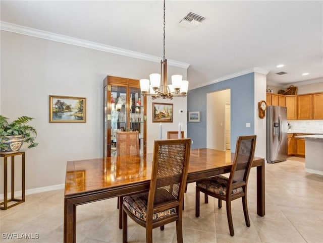 13117 Cardeto Ct, Estero, FL 33928 - dining room featuring visible vents, an inviting chandelier, light tile patterned flooring, crown molding, and baseboards