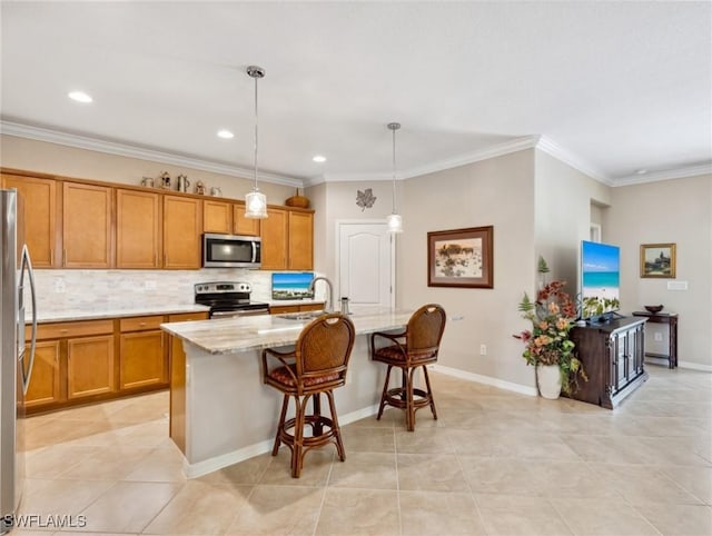 13117 Cardeto Ct, Estero, FL 33928 - kitchen with an island with sink, stainless steel appliances, a breakfast bar area, brown cabinetry, and decorative backsplash