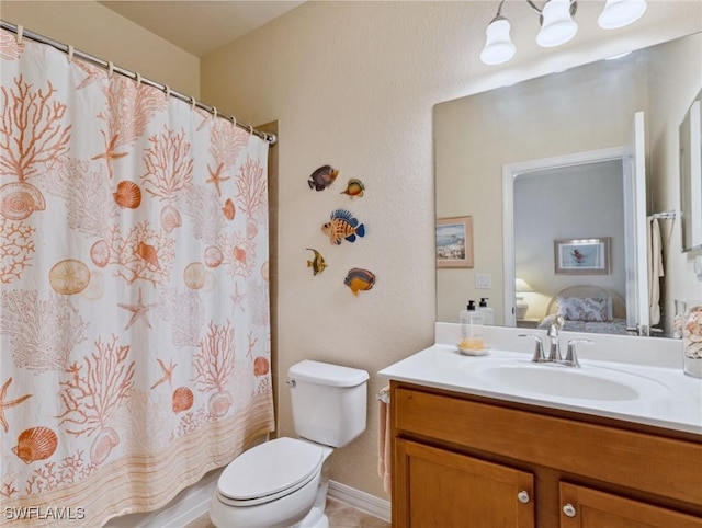 13117 Cardeto Ct, Estero, FL 33928 - bathroom with curtained shower, vanity, toilet, and ensuite bathroom