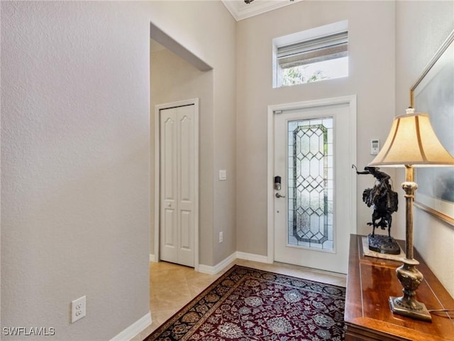 13117 Cardeto Ct, Estero, FL 33928 - foyer entrance with light tile patterned flooring, crown molding, and baseboards