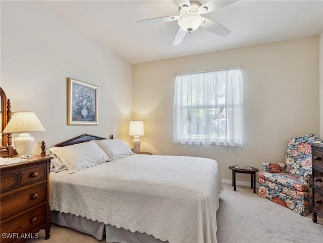 13117 Cardeto Ct, Estero, FL 33928 - bedroom featuring baseboards, light colored carpet, and a ceiling fan