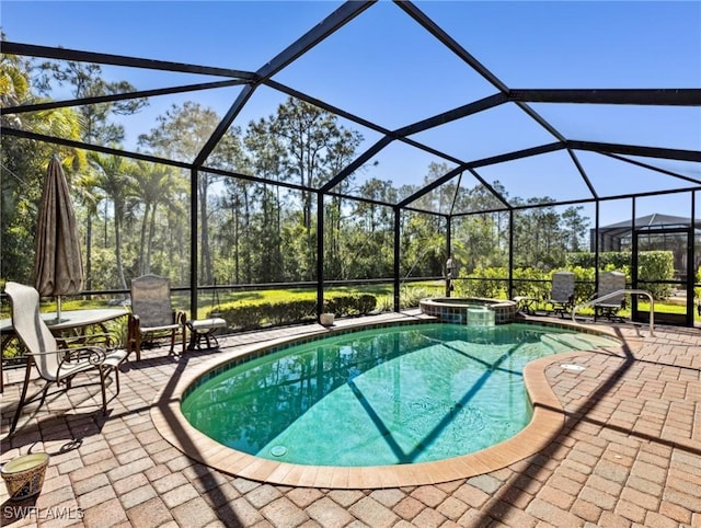 13117 Cardeto Ct, Estero, FL 33928 - view of swimming pool with a lanai, a pool with connected hot tub, and a patio