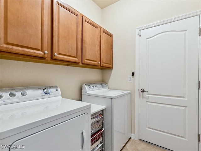 13117 Cardeto Ct, Estero, FL 33928 - laundry area with washer and clothes dryer, cabinet space, and light tile patterned flooring