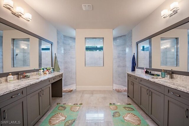 9121 Caicos Way, Naples, FL 34114 - bathroom with walk in shower, two vanities, and healthy amount of natural light