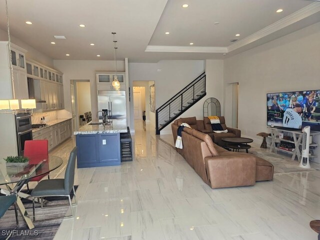 9121 Caicos Way, Naples, FL 34114 - living room with stairway, crown molding, recessed lighting, light marble finish flooring, and a raised ceiling