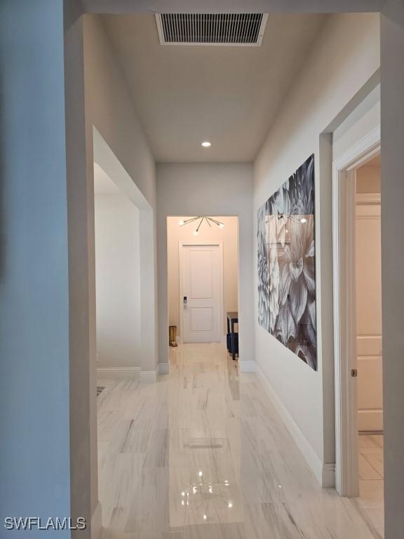 9121 Caicos Way, Naples, FL 34114 - hall with marble look tile flooring, baseboards, and recessed lighting