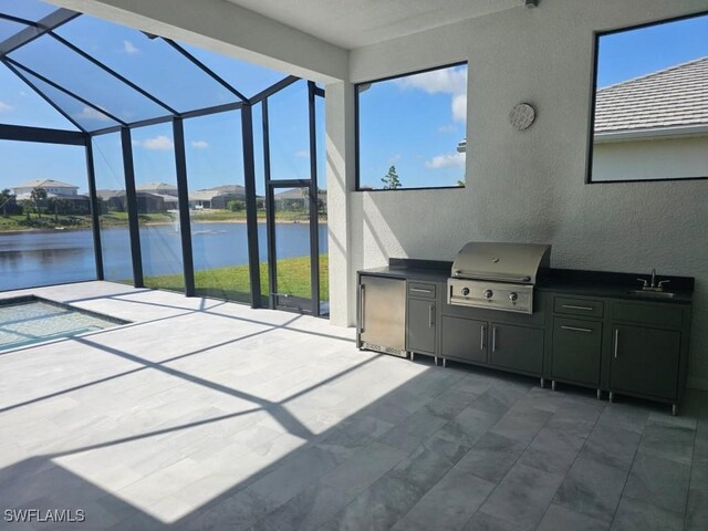 9121 Caicos Way, Naples, FL 34114 - view of patio / terrace with a water view, a lanai, and a sink