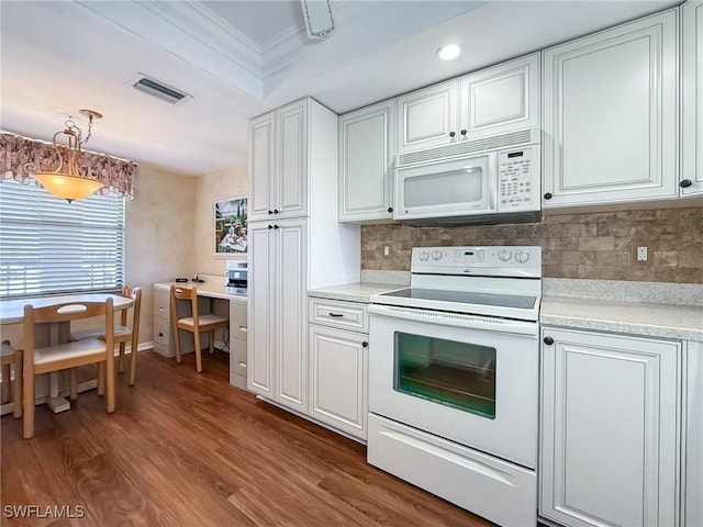 kitchen featuring visible vents, crown molding, light countertops, white appliances, and white cabinetry