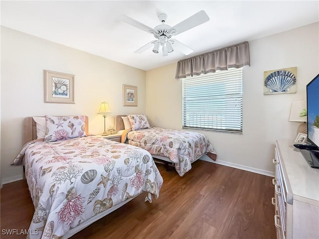 bedroom with dark wood-type flooring, baseboards, and ceiling fan