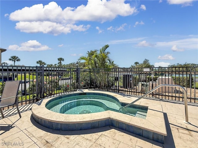 view of swimming pool with a community hot tub