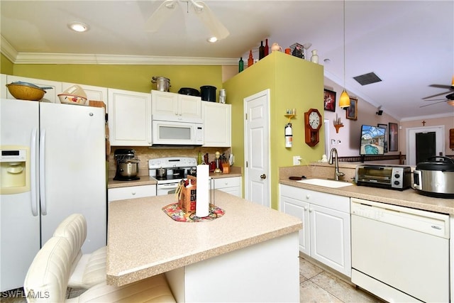 kitchen featuring ceiling fan, ornamental molding, white appliances, white cabinetry, and a sink